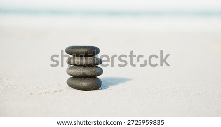 Beach, stone tower and stack with sand, nature and meditation practice for balance. Empty, ocean and wellness with chakra, zen and rocks for patience, spiritual tribute and equilibrium with shoreline