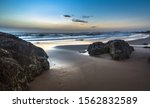 beach sunrise gold coast Currumbin sandy rocky shore clear calm early morning