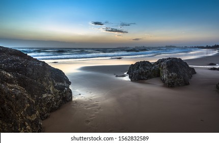 beach sunrise gold coast Currumbin sandy rocky shore clear calm early morning