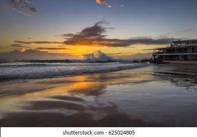 beach sunrise reflections high tide gold coast waves crashing rocky coast