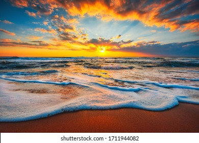 Beach sunrise  or sunset over the tropical sea and sky with clouds