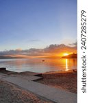 Beach At Sunset With Clouds