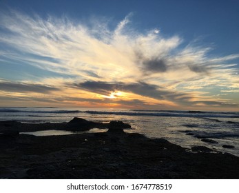 beach at sunset with clouds
