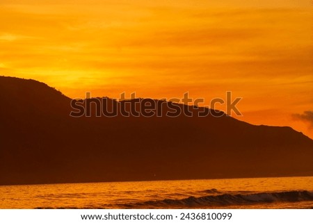 Beach with sunset view of ocean waves