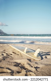 Beach, Surfboard And Sand In Nature, Summer Aesthetic Of Los Angeles At Sunset. Sport, Freedom And Adventure With Waves In Ocean To Enjoy Water Sports, Fun And Stress Relief In A Tropical Paradise