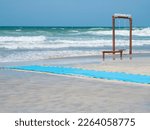 Beach swing on the shore, stormy sea. Al Khan beach. UAE,Sharjah