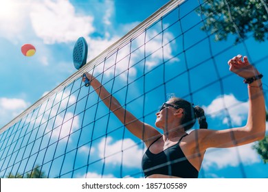 Beach Tennis Player at the Net - Powered by Shutterstock