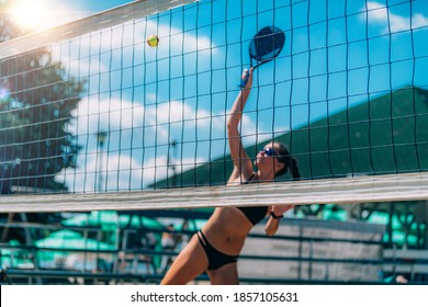 Beach Tennis Player at the Net - Powered by Shutterstock