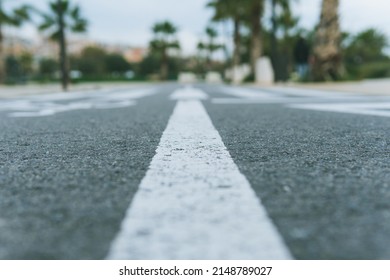 Beach Town Bike Lane. Highly Defocused Ground Level Image Of A Paved Bike Path Leaving Copy Space Below The Horizon.