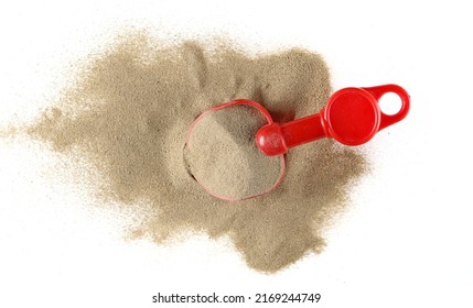 Beach Toy For Kids, Plastic Tool In Sand Pile Isolated On White, Top View