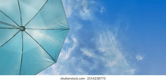 beach umbrella and blue sky background. Holydays banner background with copy space - Powered by Shutterstock