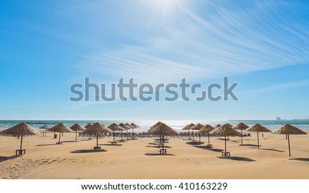 Beach umbrellas on the the beautiful empty beach.