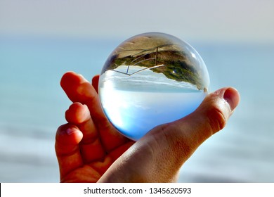 Beach upside down in a crystal ball.