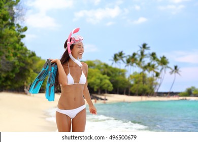 Beach vacation snorkel girl snorkeling with mask and fins. Bikini woman relaxing on summer tropical getaway doing snorkeling activity with snorkel tuba and flippers sun tanning. Caribbean destination. - Powered by Shutterstock