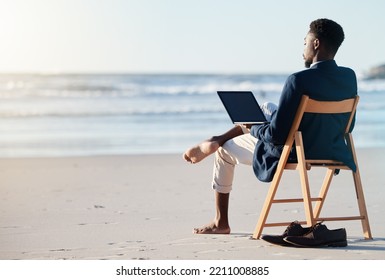 Beach vacation, work travel and black man doing business on holiday reading an email with 5g internet while working by ocean. Relax, break and happy African male doing remote work on a chair in Bali - Powered by Shutterstock