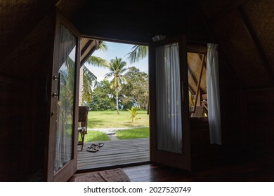 beach view with bungalow and garden on borneo - malaysia