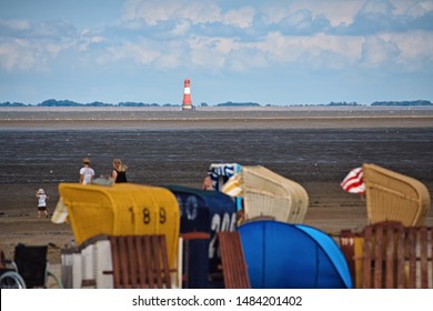 Beach view to a lighthouse