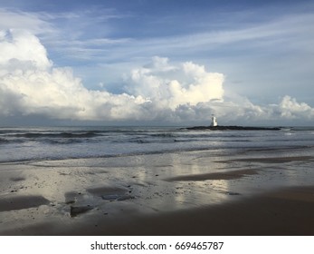 Beach view with a lighthouse