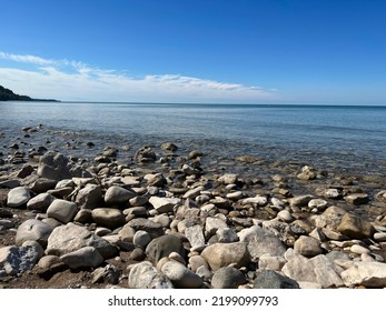Beach View With Rocks In Front
