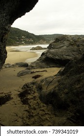 beach view through rocks