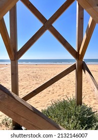 Beach View Through Wooden Window