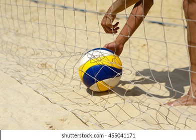 Beach Volley Ball: Man Picks Up A Ball