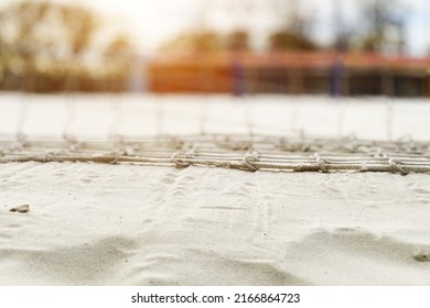 beach volleyball background, net in the sun, sand on the coast, sports and recreation