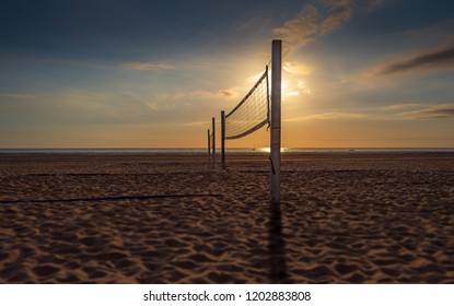 beach volleyball net sunset