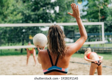 Beach Volleyball, Female Player Serving the Ball - Powered by Shutterstock