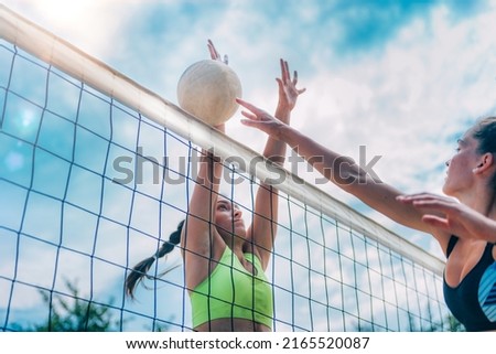 Beach Volleyball Female Players on the Net