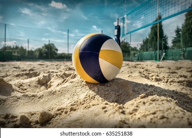 Beach Volleyball. Game ball under sunlight and blue sky.