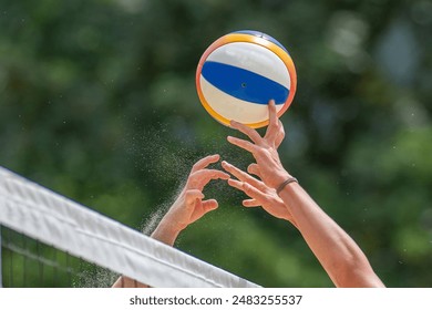 Beach volleyball game with hands and net - Powered by Shutterstock