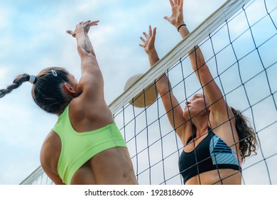 Beach Volleyball Players at the Net - Powered by Shutterstock