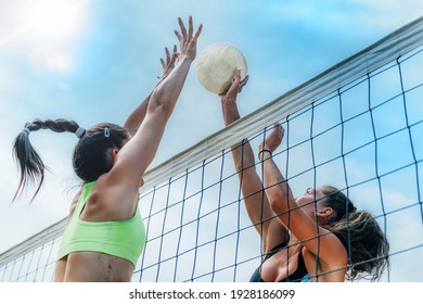 Beach Volleyball Players at the Net - Powered by Shutterstock