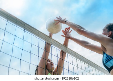 Beach Volleyball Players at the Net