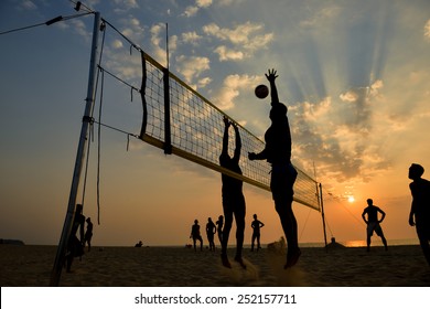 Beach Volleyball Silhouette At Sunset , Motion Blurred