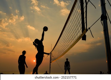 Beach Volleyball Silhouette At Sunset , Motion Blurred