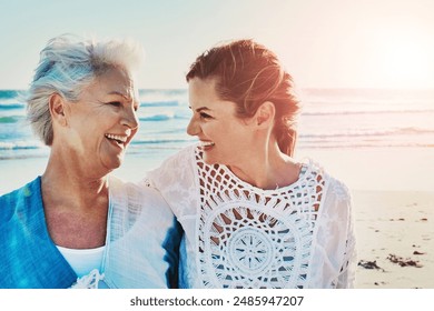 Beach, walking and woman with senior mother for travel, vacation or weekend trip in summer. Happy, love and person with elderly mom by ocean for bonding on tropical holiday for retirement celebration - Powered by Shutterstock