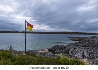 Beach Warning Flag On Coral Strand Beach Galway Ireland