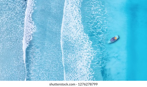 Beach and waves from top view. Turquoise water background from top view. Summer seascape from air. Top view from drone. Travel concept and idea - Powered by Shutterstock