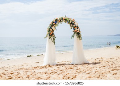 beach wedding venue, wedding setup, cabana, arch, gazebo decorated with flowers, beach wedding setup