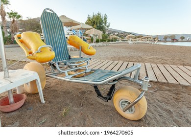 Beach wheel chair for disabled swimmers in the beach. Concept of access to sea bathing and swimming for the disabled and people with reduced mobility. - Powered by Shutterstock