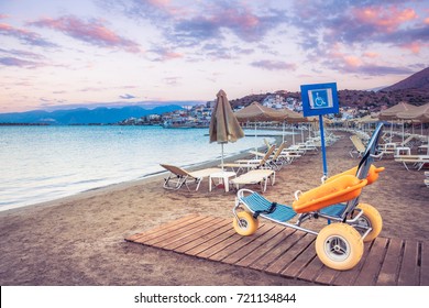 Beach wheel chair for disabled swimmers, Elounda, Crete, Greece. - Powered by Shutterstock