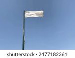 Beach white flag weather wind on blue sky background, It indicates that the beach has successfully passed testing according to 27 international criteria