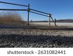 Beach and wooden fench. Nature park of Mettau. Rudolfzell Bodensee, Baden Wurttemberg Germany. 