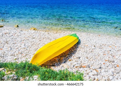 Beach with yellow canoe