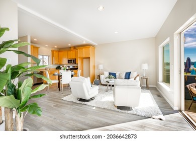 Beachfront condo living room with big windows ocean view white decor