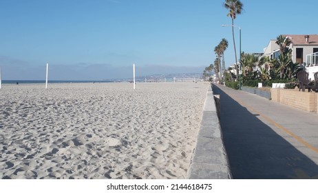 Beachfront houses on waterfront walkway, ocean beach in California, USA. Holiday, vacations or weekend rental homes on sea coast near Los Angeles. Waterside property on shore, Mission beach, San Diego