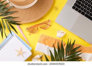 Beach-inspired remote work station.Top view photo of straw hat, pink sunglasses, notepads, palm leaves, seashells and laptop on yellow background - Powered by Shutterstock