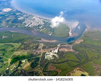 BEACHMERE, QUEENSLAND, AUSTRALIA : Caboolture River Mouth And Associated Mangrove Wetlands With Wastewater Treatment Plant, With Beachmere Suburb And Rural Residential, On Shores Of Deception Bay.